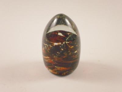 A Mdina mottled glass bullet shaped paperweight