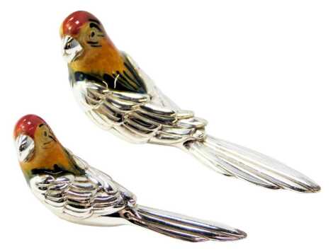 Two silver and enamel figures modelled as macaws, each stamped 925, 3cm high and 2.5cm high.