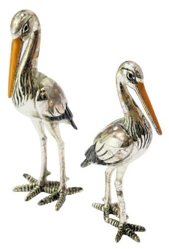 Two silver and enamel figures modelled as storks, stamped 925, 8cm high and 7cm high. (AF)