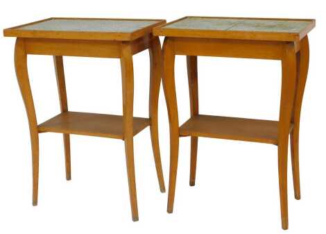 A pair of mid century French beech two tier occasional tables, raised on slender cabriole legs, 76cm high, 55cm wide, 37cm deep.