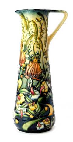 A Moorcroft pottery ewer decorated in the Prairie pattern, designed by Rachel Bishop, impressed marks and dated 2001, 23.5cm high, boxed.