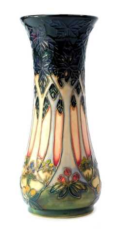 A Moorcroft pottery vase decorated in the Cluny pattern, of waisted form, designed by Sally Tuffin, impressed marks, 20cm high, boxed.