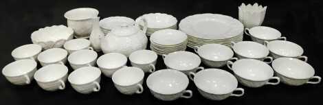 A Wedgwood and Coalport porcelain part tea and dinner service decorated in the Country Ware pattern, comprising eight dinner plates, six breakfast bowls, ten teacups, eight saucers, nine soup bowls, ten saucers, teapot and three bowls.