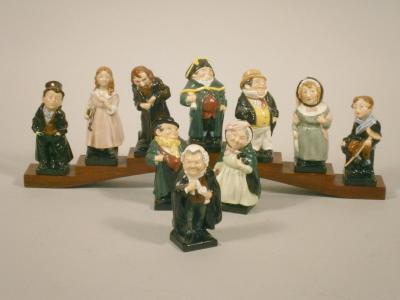 Nine Royal Doulton porcelain Dickens figures