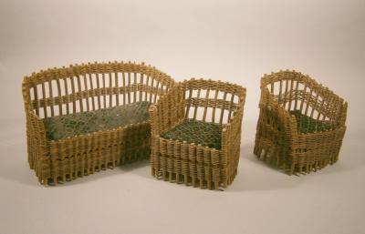 An early 20thC woven rattan toy three piece suite