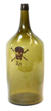 A 19thC German green glass poison bottle, decorated with a skull and crossbones, and 'Goft', 38cm high.