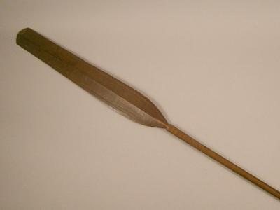 Tribal Art. A paddle with scratched carved type decoration and part turned handle