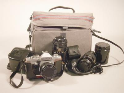 A Praktika Super TL3 camera and accessories.