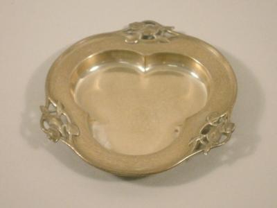 A silver trefoil shaped dish cast in Art Nouveau style with Irises