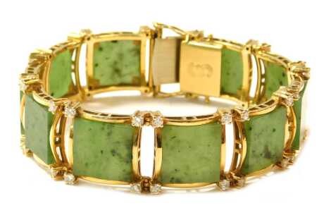 A jade and diamond bracelet, the panel set with square cut jade, round brilliant cut diamonds set over ten sections, yellow metal stamped 18ct, 48.2g all in.