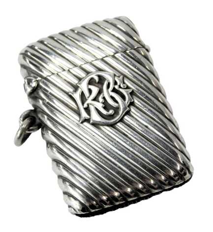 A Victorian silver Vesta case, of horizontal ribbed form, bearing raised initials, Birmingham 1878, 5cm high, 0.91oz.