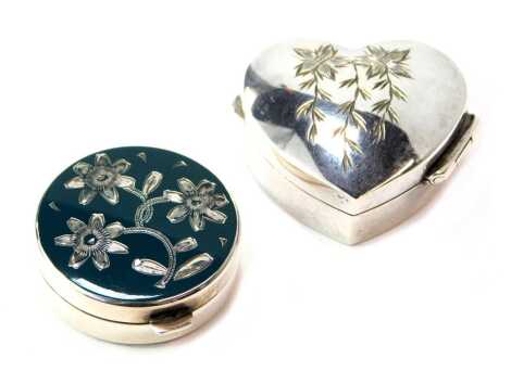 An Elizabeth II silver pill box, of heart shaped form, the lid bright cut decorated with flowers, London 1994, together with a 20thC pill box, of circular form, with a turquoise enamel top decorated with bright cut flowers, stamped sterling 925, 1.73oz. (