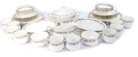 A Royal Albert porcelain part tea and dinner service decorated in the Paragon Belinda pattern, including lidded tureen, dinner plates, breakfast bowls, oval serving dishes, milk jug, gravy boat, tea cups and saucers, etc. (a quantity)