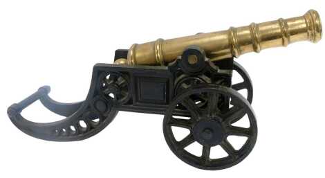 A brass and cast iron table cannon, 43cm long.