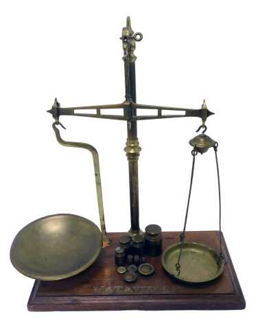 A set of W & T Avery Ltd Birmingham brass table scales, on mahogany base, 52cm high, together with various brass weights.