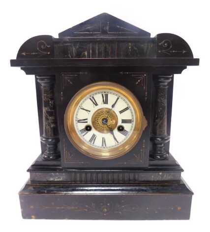 A Victorian mantel clock, the brass dial with cream enamel chapter ring, bearing Roman numerals, eight day, the wooden simulated slate and marble case of architectural form, 37cm high.