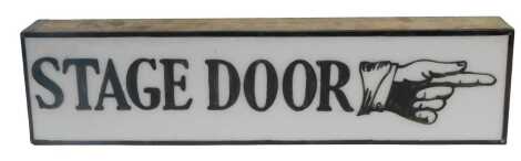 A Stage Door sign, of rectangular form, in simulated wood casing, 57cm wide.