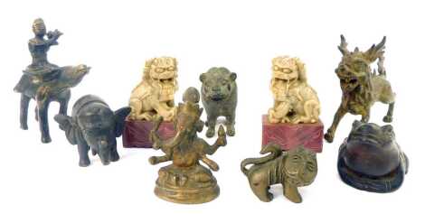 A group of cast metal Eastern figures, comprising Indian model of a figure riding bison, 13cm high, toad, 6cm high, elephant, lion, stylised wild cat, figure of Ganesh, stylised dragon, and a pair of soapstone Dog of Fo, 10cm high. (9)