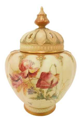 A Royal Worcester blush ivory porcelain vase and cover, the lid with shaped finial and pierced decoration, the body handpainted with flowers, on circular foot, purple printed marks, No. 1312, 19cm high. (AF)