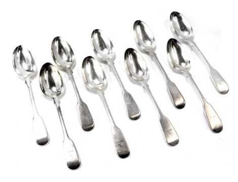 A Victorian matched set of nine silver fiddle pattern teaspoons, each with a crest, maker JW, London 1839, 6.7oz.