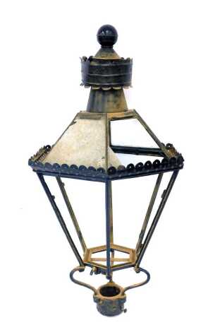 A cast iron framed outdoor lantern, of hexagonal form, some glass plates loose, others missing, approx 115cm high. (AF)