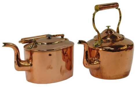 Two copper kettles, the largest 31cm high.