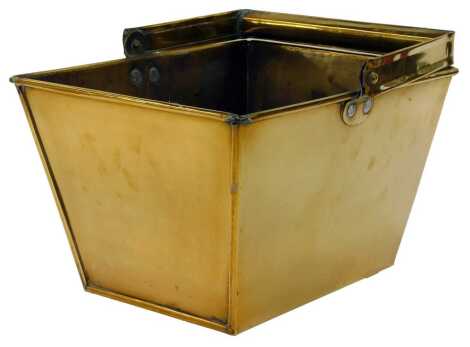 A Victorian brass casket or bucket, of rectangular tapering form, with swing handle, 26cm x 34cm.