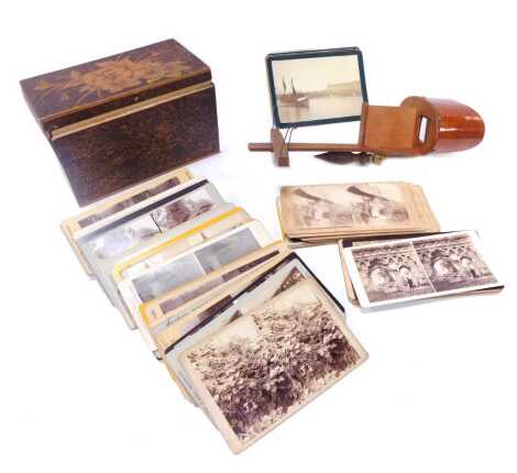 A Victorian pokerwork box, containing stereoscopic cards chiefly British topographical, together with an early 20thC stereoscopic viewer.