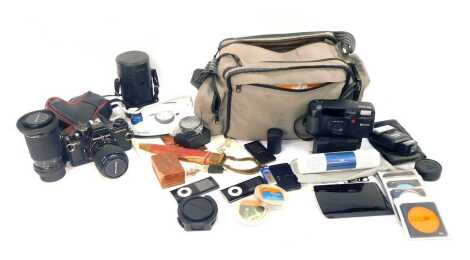 A Praktica BC1 electronic camera, with additional lenses, and carry bag, Ricoh RZ-800 camera, travel iron, etc. (a quantity)