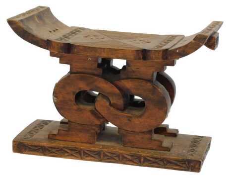 A Ghanaian Ashanti Wisdom knot stool, 54cm wide.