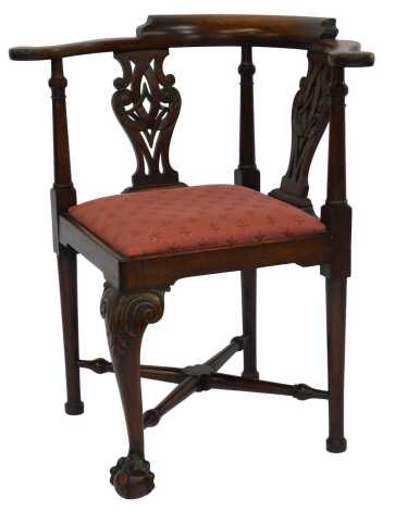 A 20thC Chippendale mahogany corner chair, raised on leaf carved cabriole legs, on ball and claw feet, united by an X stretcher, 75cm wide.