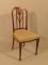 An Edwardian mahogany and marquetry bedroom chair