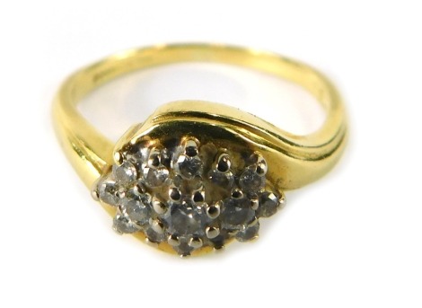 An 18ct gold diamond cluster ring, set with three layers of round brilliant cut diamonds, on twist design ring head, London 1973, ring size P½, 4.2g all in.