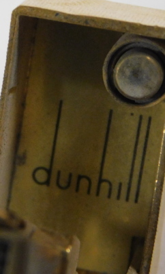 A Dunhill gold plated lighter, with engine turned and textured finish, emblem to front, 6.5cm long. - 3