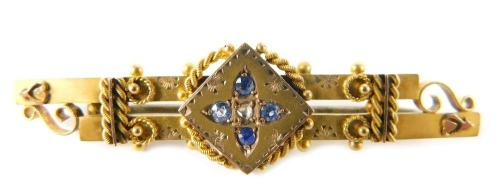 A 9ct gold double bar brooch, set with sapphires with raised decoration, 3.3g all in.