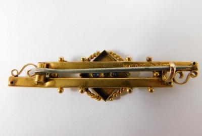 A 9ct gold double bar brooch, set with sapphires with raised decoration, 3.3g all in. - 2