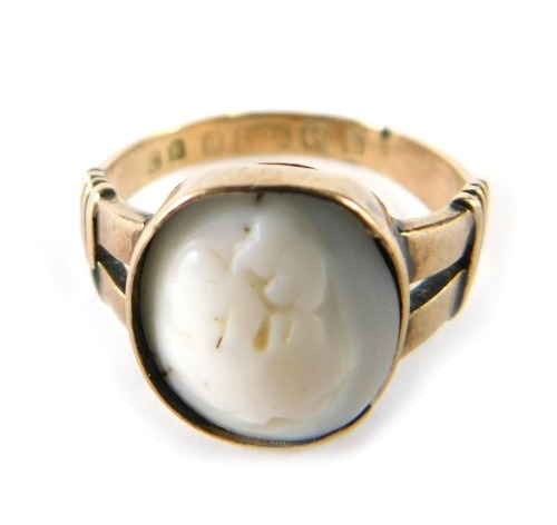 A 19thC cameo dress ring, mounted centrally with a cameo, bearing hallmarks, 9ct, adapted, ring size K, 2.7g all in.