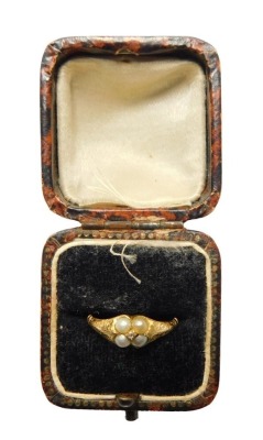 A Victorian seed pearl dress ring, set with four seed pearls and central tiny diamond, yellow metal, unmarked, 2g all in.