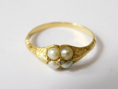 A Victorian seed pearl dress ring, set with four seed pearls and central tiny diamond, yellow metal, unmarked, 2g all in. - 2