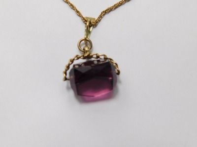 A 9ct gold and amethyst swivel seal, mounted to fine link neck chain, unmarked, 8.8g all in. - 2