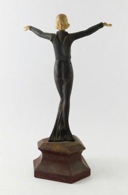 A resin Art Deco style figure of a dancer, on a simulated marble base, 36cm high. - 2