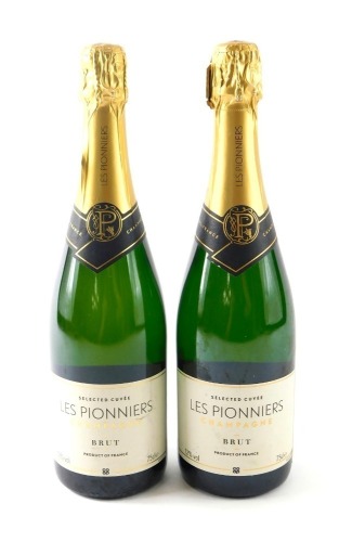 Two bottles of Les Pionniers Co-op Champagne.