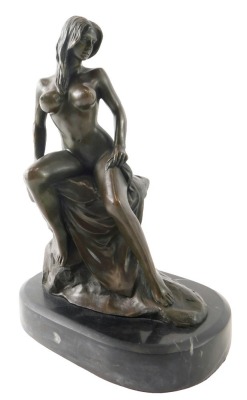 After Milo. Female nude seated on a rock, bronze, on marble base, 29cm high. 