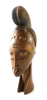 Tribal Art. Carved bust of a female with elaborate hair design, 36cm high.