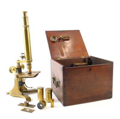 A brass microscope, 38cm high, and various accessories.