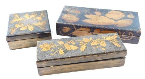 Three late 19th/early 20thC poker work boxes, each decorated with flowers and leaves, the largest 37cm wide.