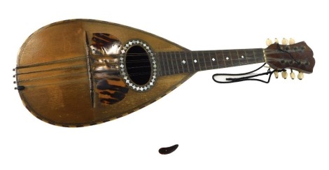 An Italian mandolin, bearing label for Luigi Corradotti Figli Roma, with rosewood back and mother of pearl inlay, 62cm long.