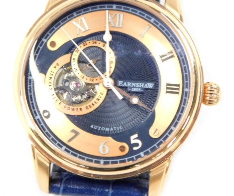 An Earnshaw automatic gentleman's wristwatch, with twenty four jewels, forty one hour power reserve, in gold plated case with blue leatherette strap.