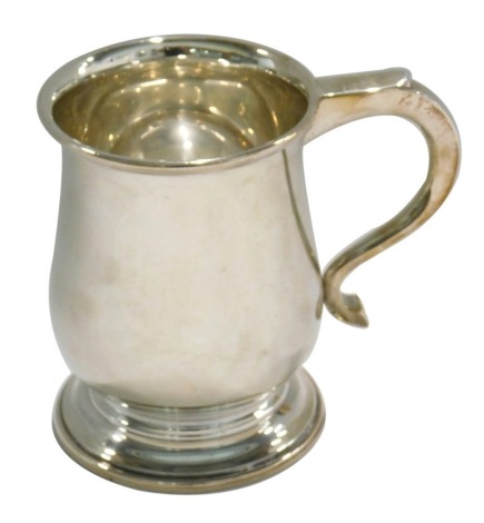 A George VI silver baluster shaped tankard, on a domed foot, Birmingham 1946, 10.84oz, 12cm high.