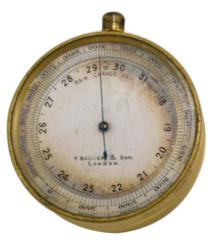 A Barker and Son London pocket barometer, in brass case with outer travelling case, the barometer, 5cm diameter.